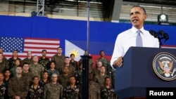 U.S. President Barack Obama speaks to military troops at the Fort Bonifacio Gymnasium in Manila, Apr. 29, 2014.