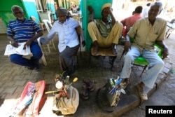 Workers wait for customers at a market in Khartoum, Sudan Nov. 11, 2017.
