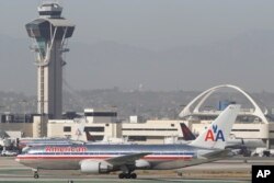 FILE - An American Airlines Boeing 767 waits to take off at Los Angeles International Airport.