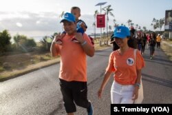 Jimmy Liguo with his wife Lisa and son Jimmy Jr. attend the ‘Walk for Elephants’ march in Dar es Salaam.