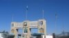FILE - Soldiers stand by the closed gates of Pakistan's border post, after Pakistan sealed its border with Afghanistan to guard against the spread of the coronavirus, at the Friendship Gate crossing point at Chaman, Pakistan, March 2, 2020.
