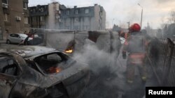 A view of emergency workers at the site of a Russian missile strike, amid Russia’s attack on Ukraine, in Kyiv, Ukraine March 9, 2023. (REUTERS/Gleb Garanich)