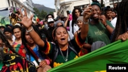 FILE - A protester carries a marijuana pipe during a march calling for the legalization of cannabis in Cape Town, South Africa, May 7, 2016. On Friday, Western Cape province's High Court ruled that marijuana can now be legally grown and smoked in the privacy of one's home.