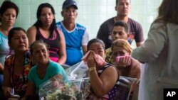 Grieving relatives of passengers who perished in Cuba's worst aviation disaster wait at the morgue for the identification of the bodies in Havana, Cuba, May 20, 2018.