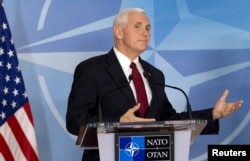 FILE - U.S. Vice President Mike Pence briefs the media during a meeting with NATO Secretary-General Jens Stoltenberg at the Alliance headquarters in Brussels, Belgium, Feb. 20, 2017.