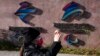 A woman takes photos near the logos for the Beijing Winter Olympics and Paralympics in Beijing, China, Nov. 9, 2021. China on Dec. 7 accused the United States of violating the Olympic spirit by announcing an American diplomatic boycott of February's Beijing Winter Games.