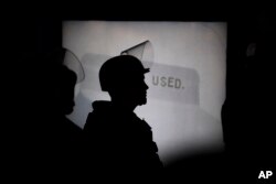 A police officer monitors the scene during a speech by Ben Shapiro on the campus of the University of California n Berkeley, Calif., Sept. 14, 2017.