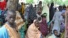 FILE - Refugees fleeing Boko Haram attacks on the town of Bama take shelter at a school in Maiduguri, Nigeria, Sept. 3, 2014.