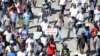 FILE - Demonstrators take part in a protest against Haiti's President Jovenel Moise, in Port-au-Prince, Haiti, Feb. 14, 2021.