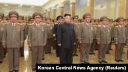 FILE - North Korean leader Kim Jong Un, center.