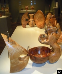 Curator Nicolas Bell says about two to three dozen exotic woods, including African Black wood, pink ivory and ebony, are represented in the exhibit.