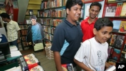Harry Potter fans purchase copies of the final Potter book at a New Delhi bookstore, a high seller at Internet retailer Amazon, (File photo).