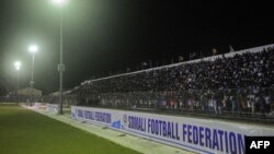 People gather for the soccer match between Hodan and Waberi districts, Mogadishu's first night game in 30 years, at Konis Stadium in Modadishu, Somalia, Sept. 8, 2017.