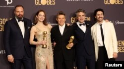 Yorgos Lanthimos, Emma Stone, Willem Dafoe, Mark Ruffalo and Ramy Youssef with the award for Best Motion Picture - Musical or Comedy award and Best Performance by a Female Actor in a Motion Picture - Musical or Comedy for "Poor Things," Jan. 7, 2024.