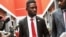 FILE - Bobi Wine, center, arrives to speak at the National Unity Platform head office in Kampala, Uganda, Aug. 31, 2020. Wine recently asked his followers on social media to financially support the party's parliamentary candidates. 