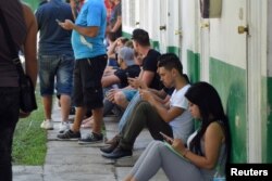 Cubans gather at the migration office while waiting for their safe passage to cross Mexico after Washington repealed a measure granting automatic residency to virtually every Cuban who arrived in the United States, in Tapachula, Mexico, Jan. 17, 2017.
