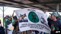 Supporters sing and chant at the Mehlareng stadium in Tembisa during a recruitment drive for the newly launched Umkhonto We Sizwe political party backed by former South African President, Jacob Zuma on January 21, 2024. (Photo by EMMANUEL CROSET / AFP)