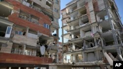 Buildings are damaged by an earthquake in a compound which was built under the Mehr state-owned program, in Sarpol-e-Zahab in western Iran, Nov. 14, 2017.