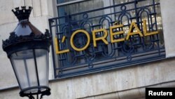 FILE - The logo of French cosmetics group L'Oreal is seen on a company building in Paris, France, Feb. 7, 2024. L'Oreal is among cosmetics companies in France hoping to minimize the impact of harsh new Chinese import rules.
