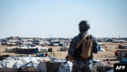 Special forces of the Syrian Democratic Forces keep watch in the vicinity of al-Hol camp, in Syria's northeast, March 30, 2021.
