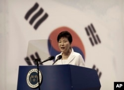 FILE - South Korean President Park Geun-hye delivers a speech during a ceremony to celebrate Korean Liberation Day from Japanese colonial rule in 1945, at Seong Cultural Center in Seoul, South Korea, Aug. 15, 2015.
