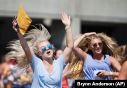 Sorority girls run after in excitement after receiving their sorority's bid for recruitment during the University of Alabama Bid Day, Saturday, August 19, 2017, in Tuscaloosa, Alabama.