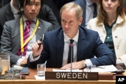 FILE - Swedish Ambassador to the U.N. Olof Skoog speaks during a Security Council meeting on the situation in Syria, April 7, 2017.