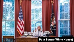 President Barack Obama talks on the phone with Cuba President Raúl Castro in the Oval Office, Sept. 18, 2015. (Official White House Photo by Pete Souza) 