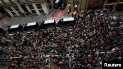 People attend a protest outside National Police police station, in Barcelona, Spain Oct. 2, 2017. 