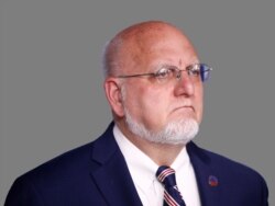 Robert Redfield Jr. headshot, as US Centers for Disease Control and Prevention director, graphic element on gray