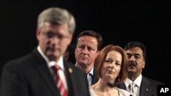 Country leaders from left, Canadian PM Stephen Harper, British PM David Cameron, Australian PM Julia Gillard, and Pakistani PM Yousuf Raza Gilani at the Commonwealth Heads of Government Meeting (CHOGM) in Perth, Australia, October 29, 2011.