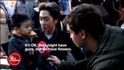 'They've got guns but we have flowers'