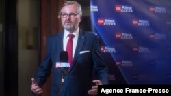 FILE - In this Oct. 9, 2021, photo, leader of Czech Republic's Civic Democratic Party Petr Fiala gives an interview after the parliamentary elections in Prague, Czech Republic.