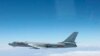 FILE - A Chinese military plane H-6 bomber flies through airspace between Okinawa prefecture's main island and the smaller Miyako island in southern Japan, photo taken Oct. 27, 2013.