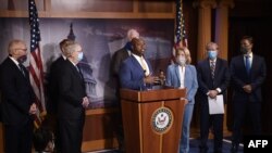 Sen. Tim Scott, R-SC, flanked by (L to R), Rep. Pete Stauber, R-MN, Senate Majority Leader Mitch McConnell (R-KY), Sen. James Lankford, R-OK, Sen. John Cornyn, R-TX, Sen. Shelley Moore Capito, R-WV, Sen. Lindsey Graham, R-SC, and Sen. Ben Sasse, R-NE, spe