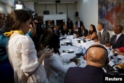 Cuban blogger Yoani Sanchez, left, attends a meeting between U.S. President Barack Obama and Cuban dissidents at the U.S. embassy in Havana, Cuba, March 22, 2016.
