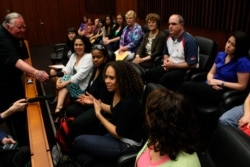 Jurors speak to reporters following a guilty verdict following the high-profile corruption trial of former Illinois governor Rod Blagojevich, Chicago, Illinois, June 27, 2011.