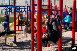 FILE - Students play during an after-school program at Circleville Elementary School, in Circleville, Ohio, March 29, 2017.