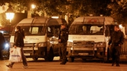 Police officers stand guard near the interior ministry in Tunis, Tunisia, Nov. 26, 2021.
