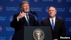 FILE - U.S. President Donald Trump accompanied by U.S. Secretary of State Mike Pompeo speaks at a news conference, following talks with North Korean leader Kim Jong Un in Hanoi, Vietnam, Feb. 28, 2019.