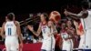 United States's Brittney Griner (15), center, and teammates celebrate after their win in the women's basketball gold medal game against Japan at the 2020 Summer Olympics, Sunday, Aug. 8, 2021, in Saitama, Japan. (AP Photo/Eric Gay)