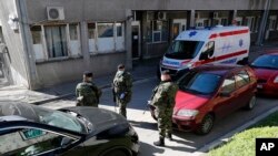 Serbian Army soldiers stand guard outside the Clinic in Belgrade, although the global COVID-19 pandemic has not hit Eastern and Central Europe with such a force compared to Italy, Spain and France, March 16, 2020.