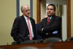Ranking member Rep. Devin Nunes, R-Calif., talks to Rep. Mike Conaway, R-Texas, after acting Director of National Intelligence Joseph Maguire testified before the House Intelligence Committee on Capitol Hill in Washington, Sept. 26, 2019.