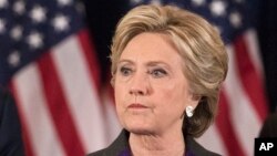 Former President Bill Clinton applauds as his wife, Democratic presidential candidate Hillary Clinton speaks in New York where she conceded her defeat to Republican Donald Trump after the hard-fought presidential election, Nov. 9, 2016.