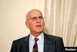 FILE - Former European Union environment commissioner Stavros Dimas speaks during a news conference at the Ministry of Foreign Affairs in Athens.