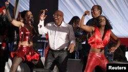 South Africa's Minister of Health, Aaron Motsoaledi (C), dances during the launch of a major HIV counseling and testing campaign at Katlehong township outside Johannesburg, April 25, 2010.