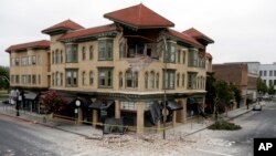 A building is partially collapsed due to a 6.0-magnitude earthquake, Sunday, Aug. 24, 2014, in Napa, California.