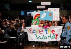 Children participate during climate march before the opening session of the COP23 U.N. Climate Change Conference 2017, hosted by Fiji but held in Bonn, in World Conference Center, Bonn, Germany, Nov. 6, 2017.