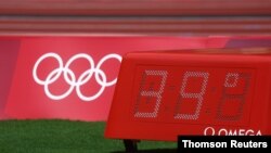  A temperature indicator reads 39 degrees Celsius at the women's long jump qualification Aug. 1, 2021, at the 2020 Olympics in Tokyo, Japan.