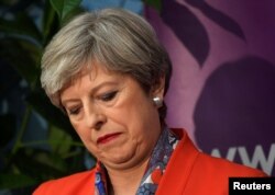 Britain's Prime Minister Theresa May waits for the result of the vote in her constituency at the count center for the general election in Maidenhead, June 9, 2017.